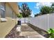 Side yard shows fenced boundary and access to the backyard at 1819 Meadowbrook Ave, Lakeland, FL 33803