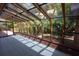 Bright sunroom with full-glass walls and ceiling at 4428 Sugartree E Dr, Lakeland, FL 33813