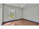 Bright bedroom with a large window and ceiling fan at 7454 Briarbay Loop, Lakeland, FL 33810