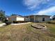 Single-story house with a two-car garage and well-maintained lawn at 7454 Briarbay Loop, Lakeland, FL 33810