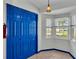 Laundry room with a washer and dryer, and blue accent walls at 7454 Briarbay Loop, Lakeland, FL 33810