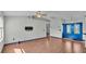 Bright living room with hardwood floors and blue accent doors at 7454 Briarbay Loop, Lakeland, FL 33810