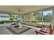 Relaxing screened porch with patio furniture at 7454 Briarbay Loop, Lakeland, FL 33810