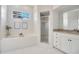 Main bathroom with a walk-in shower and a garden tub at 1803 Sandy Knoll N Cir, Lakeland, FL 33813