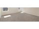 Sunlit bedroom with neutral walls and plush gray carpet at 2214 Oldham Ct, Haines City, FL 33844