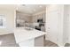 Modern kitchen with stainless steel appliances, a kitchen island, and gray cabinets at 2214 Oldham Ct, Haines City, FL 33844