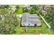 Aerial view of the home showing the roof, backyard, and landscaping at 1175 E George St, Bartow, FL 33830