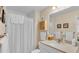 Neat bathroom with a vanity, a shower with a curtain, and neutral finishes at 1175 E George St, Bartow, FL 33830