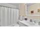 Well-lit bathroom with tub, shower, and vanity at 1175 E George St, Bartow, FL 33830