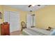 A cozy bedroom with a large closet and view into an adjacent room at 1175 E George St, Bartow, FL 33830