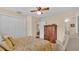 Cozy bedroom featuring natural light, closet, and access to bathroom at 1175 E George St, Bartow, FL 33830