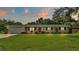 Charming single-story home with brick facade and well-manicured lawn at 1175 E George St, Bartow, FL 33830