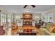 Spacious living room showcasing a brick fireplace, built-in shelves, and natural light at 1175 E George St, Bartow, FL 33830