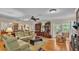 Open living space with hardwood floors, comfortable seating, and access to outdoor patio at 1175 E George St, Bartow, FL 33830