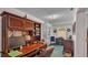 Functional home office featuring a built-in desk, storage shelves, and natural light at 1175 E George St, Bartow, FL 33830