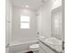 Clean bathroom featuring a bathtub and speckled countertop at 12863 Se 53Rd Ct, Belleview, FL 34420