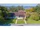 Aerial view of condo with lake view, landscaping, and walkway at 17 Loma Verde # 17, Lakeland, FL 33813