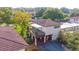 Aerial view of two-story home with private balcony, carport, and surrounding landscape at 17 Loma Verde # 17, Lakeland, FL 33813