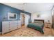 Spacious bedroom with light wood floors, and plenty of dresser space at 17 Loma Verde # 17, Lakeland, FL 33813