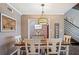 Charming dining area featuring a rustic wood table and six chairs at 17 Loma Verde # 17, Lakeland, FL 33813