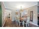 Farmhouse style dining room with wood table and brick accent wall at 17 Loma Verde # 17, Lakeland, FL 33813