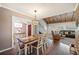 Bright dining room with farmhouse table and view into living room at 17 Loma Verde # 17, Lakeland, FL 33813