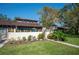 Condo with well-manicured lawn, garden, and walkway at 17 Loma Verde # 17, Lakeland, FL 33813