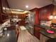 Updated kitchen with dark wood cabinets and granite countertops at 17 Loma Verde # 17, Lakeland, FL 33813