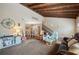 Open living room and dining area with wood beams and fireplace at 17 Loma Verde # 17, Lakeland, FL 33813