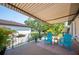 Relaxing patio with retractable awning, chairs, and potted plants at 17 Loma Verde # 17, Lakeland, FL 33813
