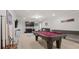 Game room with pool table, shuffleboard, and wet bar at 1944 Nice Ct, Kissimmee, FL 34747