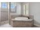 This bathroom features a soaking tub and walk-in shower with tile surround at 5074 Shore Side Dr, Lakeland, FL 33812