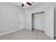 Bedroom with closet, carpet, and a ceiling fan at 5074 Shore Side Dr, Lakeland, FL 33812