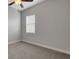 Bedroom with carpet, ceiling fan, and window at 5074 Shore Side Dr, Lakeland, FL 33812