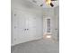 Bright bedroom featuring plush carpeting, ceiling fan and access to pool area at 5074 Shore Side Dr, Lakeland, FL 33812