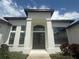 Elegant home entrance featuring double doors with decorative glass and decorative columns at 5074 Shore Side Dr, Lakeland, FL 33812