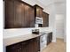 The well-equipped kitchen features modern appliances, granite counters, and ample cabinet space at 5074 Shore Side Dr, Lakeland, FL 33812