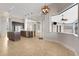 Spacious kitchen and dining area featuring a large center island and stainless steel appliances at 5074 Shore Side Dr, Lakeland, FL 33812