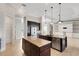 Spacious gourmet kitchen with double islands, stainless appliances, and ample lighting at 5074 Shore Side Dr, Lakeland, FL 33812