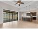 Open-concept kitchen featuring dark wood cabinets, pendant lighting, island, and direct view of the pool at 5074 Shore Side Dr, Lakeland, FL 33812