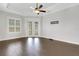Main bedroom with trey ceilings, tile floors, and access to the backyard pool at 5074 Shore Side Dr, Lakeland, FL 33812