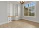 Bright home office space with built-in shelving, a custom desk, and natural light from a large window at 5074 Shore Side Dr, Lakeland, FL 33812