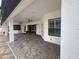 Large screened-in patio area featuring brick floors, ceiling fans, and ample space for outdoor seating at 5074 Shore Side Dr, Lakeland, FL 33812