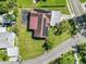 Aerial view of home with large yard and solar panels on roof at 1220 Woodland Ave, Lakeland, FL 33801