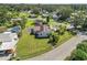 Aerial view of home and large lot with fencing in a residential neighborhood at 1220 Woodland Ave, Lakeland, FL 33801