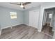 Updated bedroom with hard surface floors, closet, and ensuite bathroom at 1220 Woodland Ave, Lakeland, FL 33801