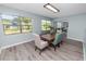 Well-lit dining room with large window and view to living room at 1220 Woodland Ave, Lakeland, FL 33801