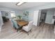 Open-concept dining room with view to living room and kitchen at 1220 Woodland Ave, Lakeland, FL 33801