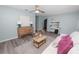Bright living room features new flooring, modern decor, and stylish furnishings creating a welcoming space at 1220 Woodland Ave, Lakeland, FL 33801