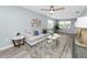 Bright living room with wood-look flooring, stylish furnishings, and open layout providing an airy feel at 1220 Woodland Ave, Lakeland, FL 33801